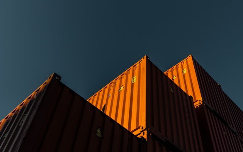 orange and black building under blue sky