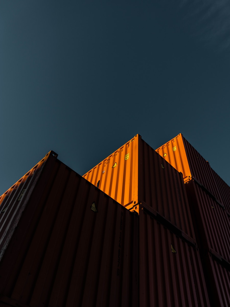 orange and black building under blue sky